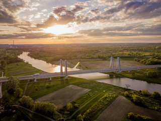 Bridge of Cardinal Franciszek Macharski in Krakow at sunset. - obrazy, fototapety, plakaty