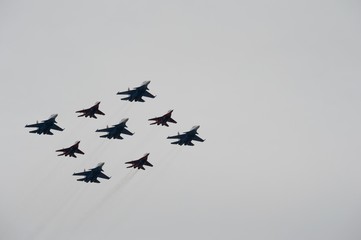 The Swifts and Russian Knights pilots on the Su-30 SM and MiG-29 planes fly over Red Square during the parade on Victory Day in World War II