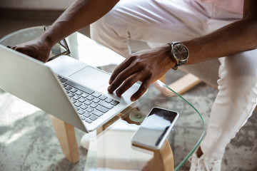 Close-up of male fingers typing a business document, note or search key on the laptop. Business, finance, education, working and online shopping concept. Preparing for online conference, videocall.