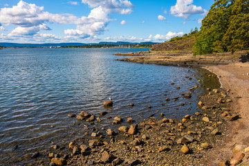 Panoramic early autumn view of rocky seashore of Hovedoya island in Oslofjord harbor near Oslo, Norway