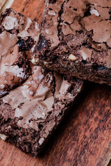 detail of chocolate brownies with nuts, studio photography