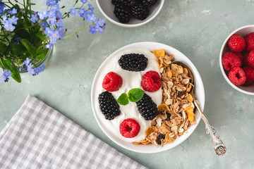 Yogurt with muesli, blackberries and raspberries