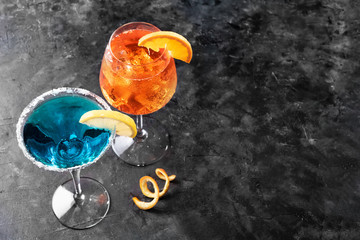 Refreshing summer drink blue lagoon cocktail and aperol spritz