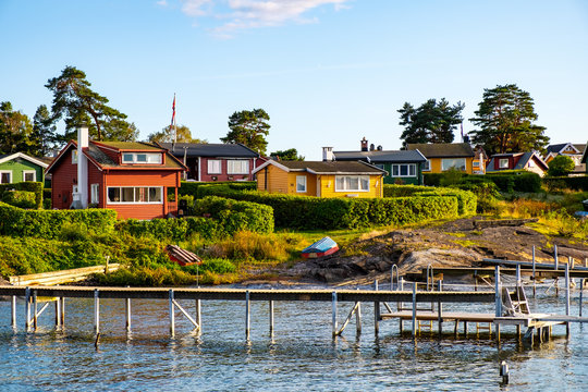 Panoramic view of Lindoya island on Oslofjord harbor near Oslo, Norway, with Lindoya Vest marina and summer cabin houses at shoreline in early autumn
