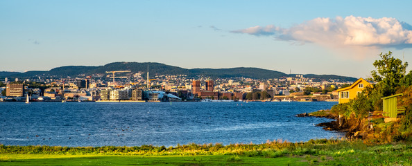 Fototapeta premium Panoramic view of metropolitan Oslo, Norway, city center seen from Nakholmen island marina on Oslofjord harbor