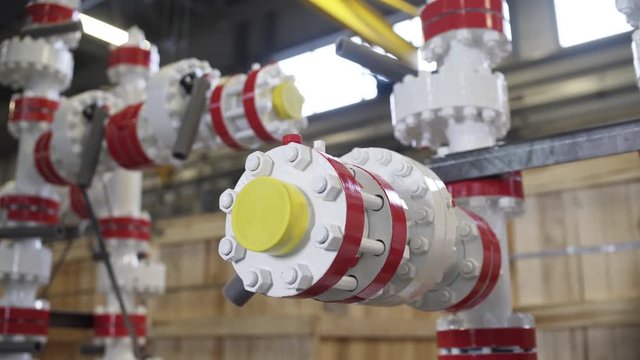 Oil and Gas Wellhead tree equipment production plant. Modifications of wellhead fittings. Modern tendencies of machine engineering. Equipment for wellhead conncetion of oil and gas wells.