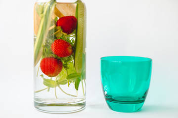 strawberry parsley cucumber mint added to water in a jug for slimming diet
