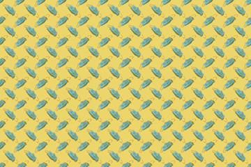 Yellow-blue pattern: a lot of little medical masks on a yellow background.