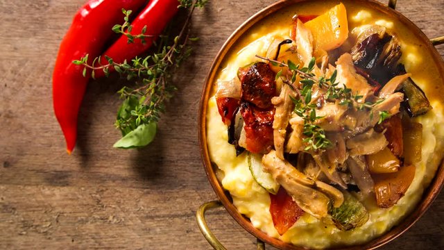 shredded chicken with mashed potatoes and vegetables. Top view with smoke. 