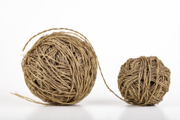 Two balls of coiled string for gardening. Cord for tying plants.