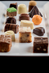 Beautiful Cceative chocolate sweets on white plate