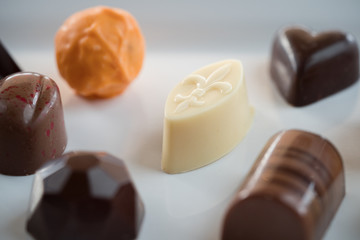 Beautiful Cceative chocolate sweets on white plate