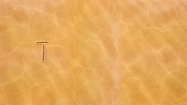 Handwritten animated text in the sand, day of the week-Thursday.
