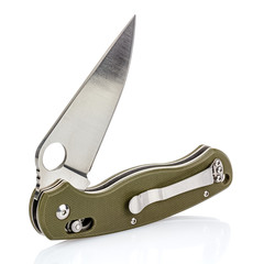 Open folding pocket knife with matte blade and textured dark green composite plastic cover plates on steel handle isolated on white background with reflection on glossy surface. Pocket knife close-up