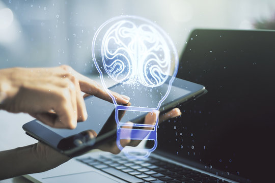Creative light bulb with human brain hologram and hand working with a digital tablet on background, artificial Intelligence and neural networks concept. Multiexposure