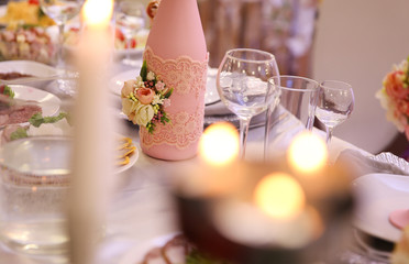 Wedding table with food and candles.
