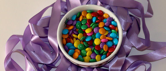 Beautiful colorful chocolates decorating the table.