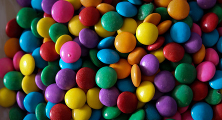 Beautiful colorful chocolates decorating the table.