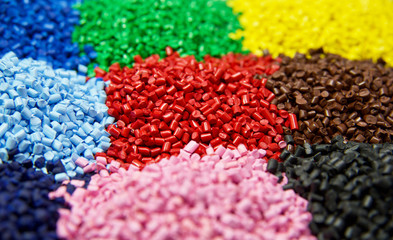 Multi colored plastic polymer granules  - obrazy, fototapety, plakaty
