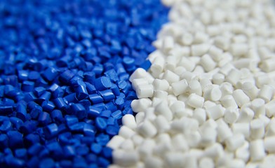 Blue and white plastic polymer granules 
