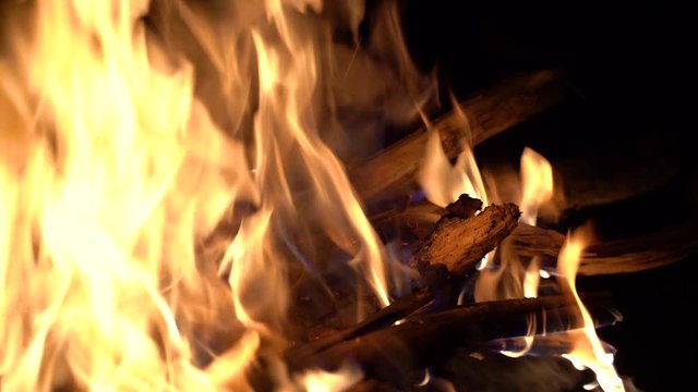 bonfire in nature. pieces of wood are burning in the fireplace. flame close up.