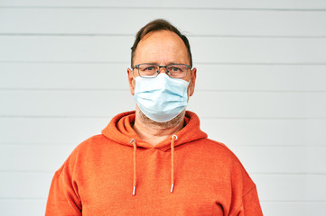 Middle age man wearing medical facial mask