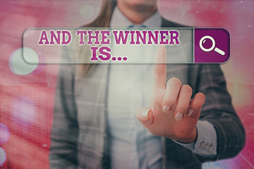 Conceptual hand writing showing And The Winner Is. Concept meaning announcing an individual or...