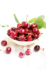 juicy ripe sweet cherries in a cup. close-up, blurred focus. copy space