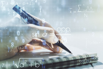 Creative scientific formula concept with woman hand writing in notebook on background. Multiexposure