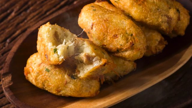 Salt cod fritters. bunuelos de bacalao with smoke. Top view