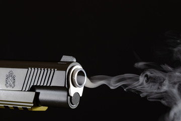 Springfield Operator 45 Cal with gun smoke