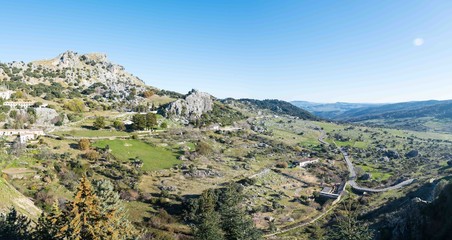 Fototapeta na wymiar View of Grazalema town while hiking up a hill in Sierra de Grazalema Natural Park, Andalusia, Spain