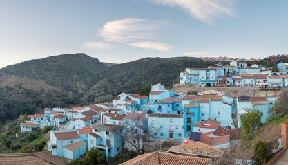 Fototapeta na wymiar Aerial view of blue houses against the backdrop of rocky hills in Andalusia, Spain