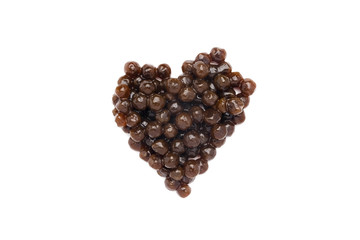 Tapioca ball or pearl tea in heart shape on isolated white background.
