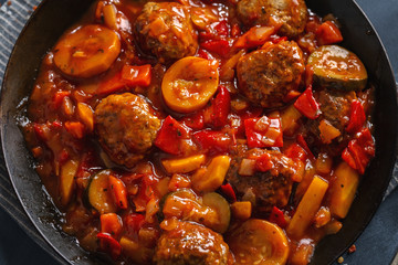 Meatballs with vegetables served on pan