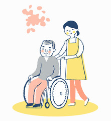 車椅子のシニア男性と女性介護スタッフ
