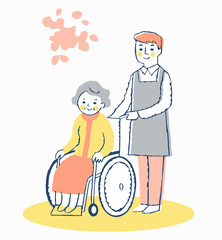 車椅子のシニア女性と男性介護スタッフ