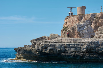 Fototapeta premium Cala Figuera - beautiful coastline and view of old lighthouse in Cala Figuera, Mallorca, Spain