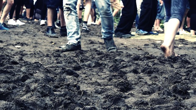 Low Section Of People On Muddy Field