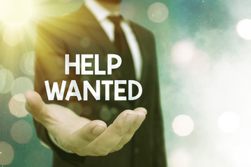 Conceptual hand writing showing Help Wanted. Concept meaning An ad in the paper an employer places...