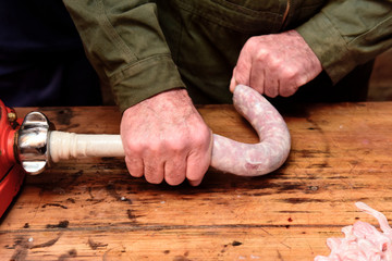 Hands making homemade sausages, Patagonia, Argentina