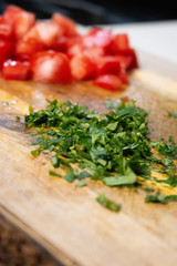 tomato and parsley on wood table