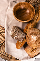 crisp, freshly baked bread. wooden plate. textiles. the straw basket. bakery