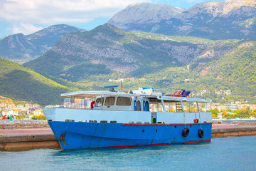 blue touristic boat at harbour 