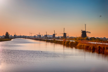 Line of Traditional Dutch Windmills in Kinderdijk Village in the Netherlands Before The Sunset.