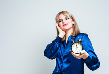 Time Ideas. Dreaming Caucasian Blond Girl Posing With Clock Against White.