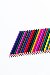 Closeup of  Various Colorful Pencils Placed Together in Row. Isolated Against White.Picture made from Upper View.