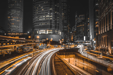 Fototapeta na wymiar Busy traffic and urban landscape at night in Hong Kong