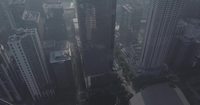 Ungraded, Tilt up aerial flight from business district to reveal skyscrapers. Drone, 4K.