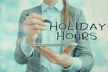 Text sign showing Holiday Hours. Business photo text employee receives twice their normal pay for...